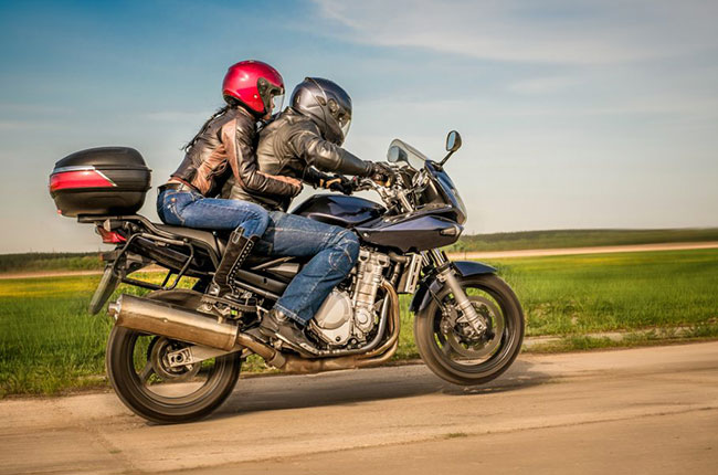 Couple riding a motorcycle 2